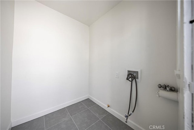 407 W 107th St, Los Angeles, CA 90003 - laundry area with gas dryer hookup, washer hookup, dark tile patterned floors, and baseboards