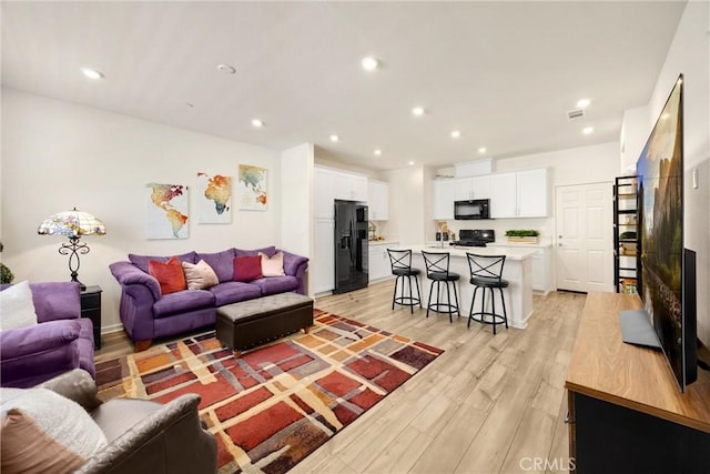 1095 W Buttercup Ln, Rialto, CA 92376 - living area with light wood-style flooring and recessed lighting