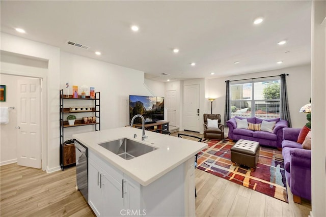 1095 W Buttercup Ln, Rialto, CA 92376 - kitchen featuring a sink, open floor plan, light wood-type flooring, stainless steel dishwasher, and recessed lighting
