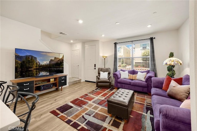1095 W Buttercup Ln, Rialto, CA 92376 - living room featuring wood finished floors and recessed lighting