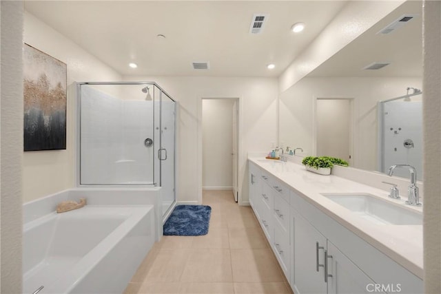 1095 W Buttercup Ln, Rialto, CA 92376 - bathroom featuring double vanity, a stall shower, a bath, tile patterned floors, and recessed lighting