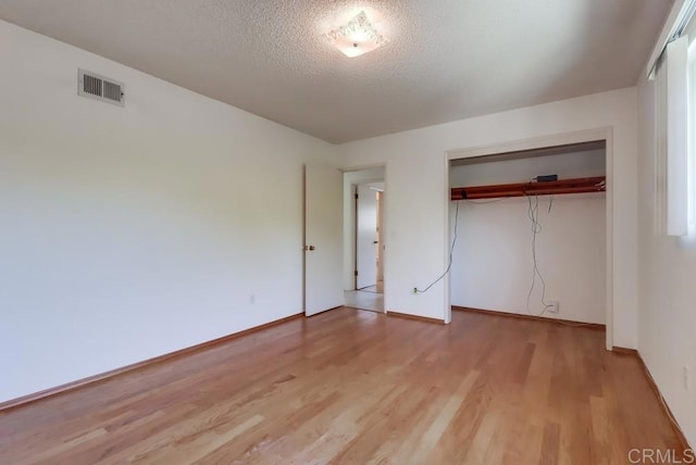 817 Cedar Ave, Chula Vista, CA 91911 - unfurnished bedroom featuring light wood-style flooring, a closet, baseboards, and a textured ceiling