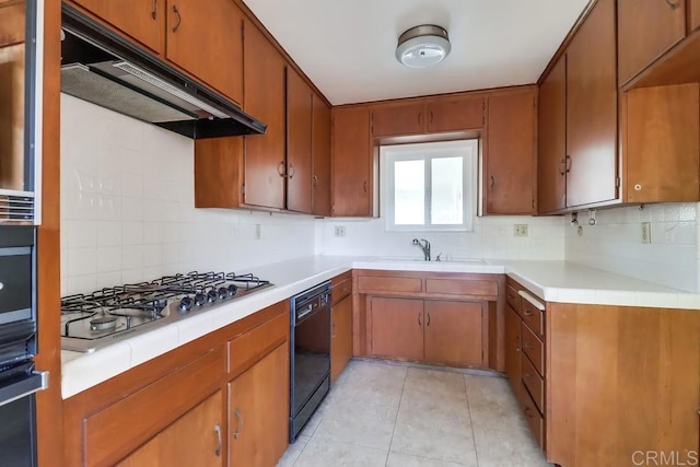 817 Cedar Ave, Chula Vista, CA 91911 - kitchen with black appliances, a sink, decorative backsplash, and under cabinet range hood