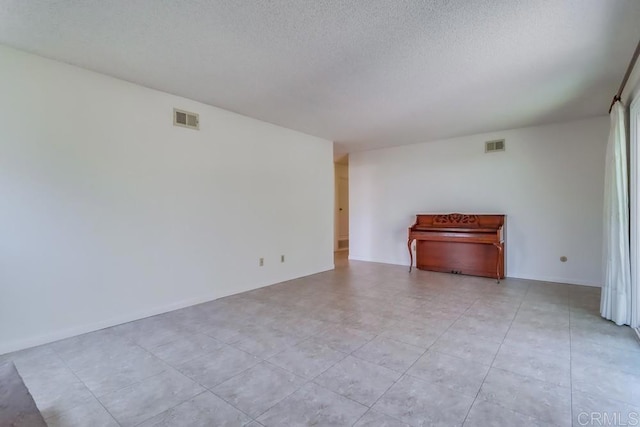 817 Cedar Ave, Chula Vista, CA 91911 - unfurnished room featuring a textured ceiling