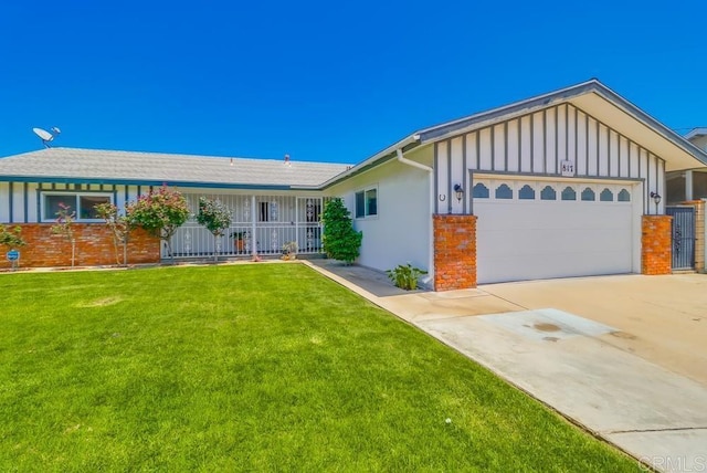 817 Cedar Ave, Chula Vista, CA 91911 - ranch-style house featuring brick siding, a front lawn, board and batten siding, an attached garage, and driveway