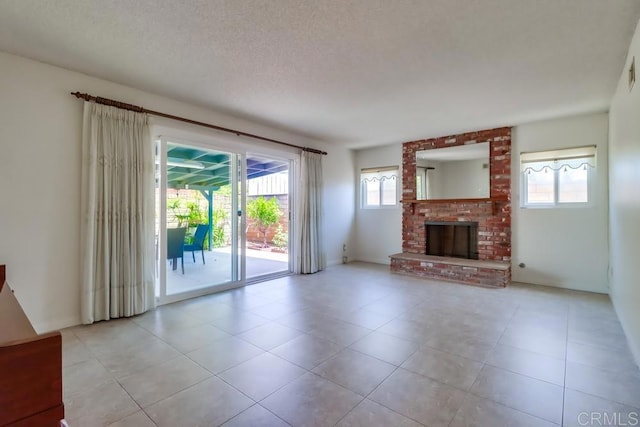 817 Cedar Ave, Chula Vista, CA 91911 - unfurnished living room with a fireplace, light tile patterned flooring, and a textured ceiling