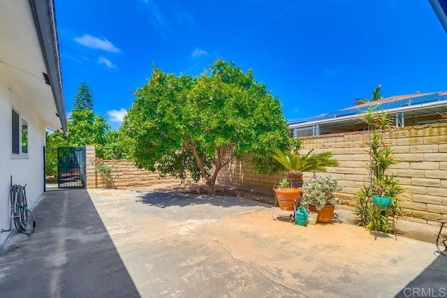 817 Cedar Ave, Chula Vista, CA 91911 - fenced backyard featuring a gate and a patio area