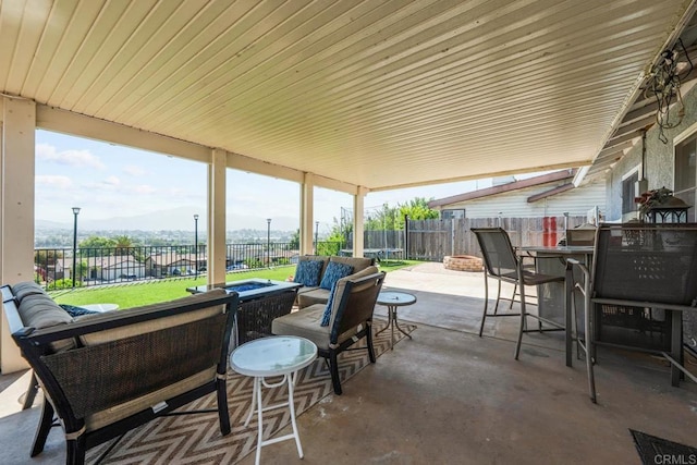 865 Worthington St, San Diego, CA 92114 - fenced backyard featuring an outdoor living space with a fire pit, a patio area, and outdoor dining space