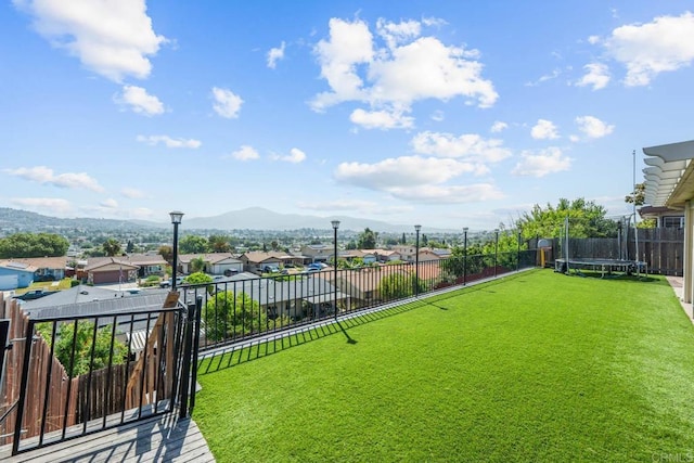 865 Worthington St, San Diego, CA 92114 - view of yard featuring a trampoline, a residential view, and a mountain view