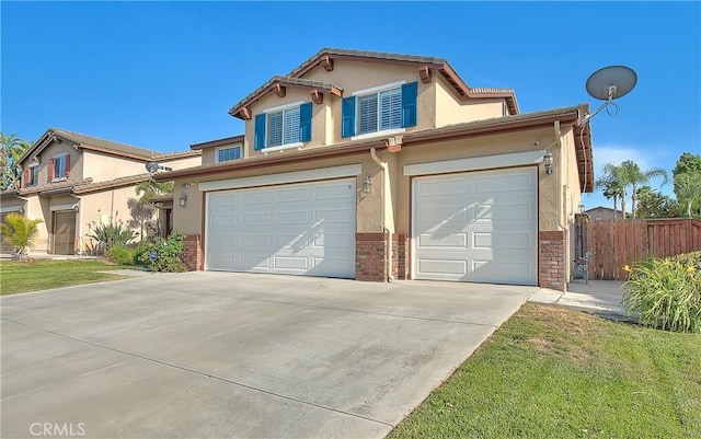 12415 Brianwood Dr, Riverside, CA 92503 - view of front of property with stucco siding, a garage, concrete driveway, and brick siding