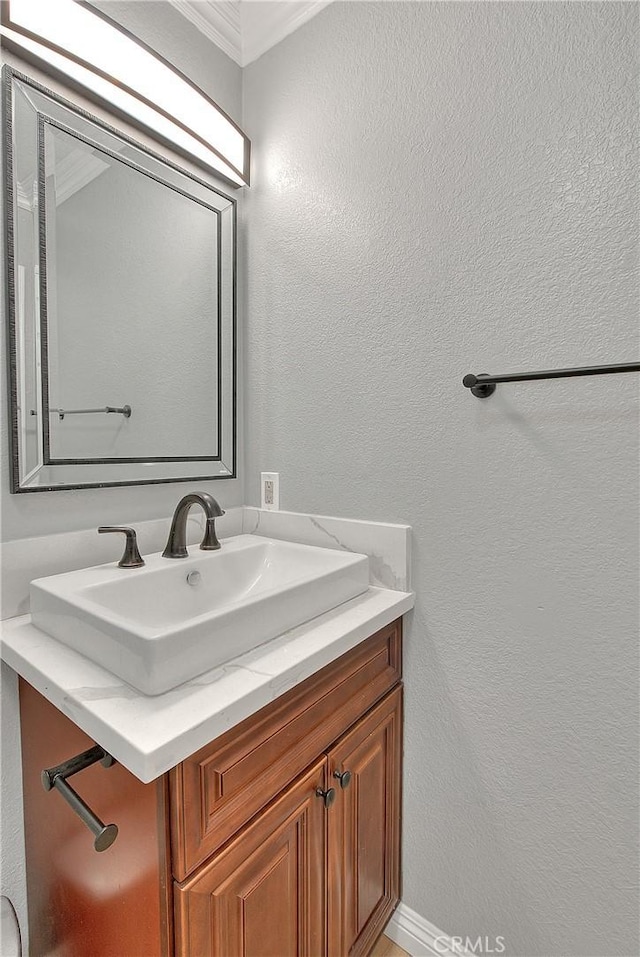 12415 Brianwood Dr, Riverside, CA 92503 - bathroom featuring vanity, a textured wall, and crown molding