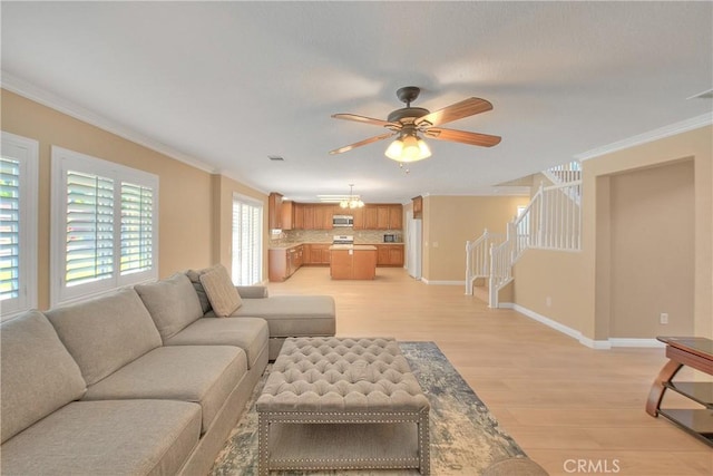 12415 Brianwood Dr, Riverside, CA 92503 - living room with crown molding, light wood-style floors, a ceiling fan, stairway, and baseboards