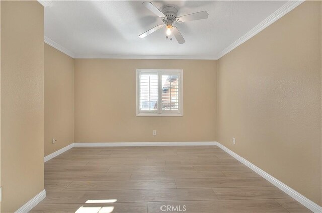 12415 Brianwood Dr, Riverside, CA 92503 - unfurnished room featuring ceiling fan, crown molding, baseboards, and light wood-style floors