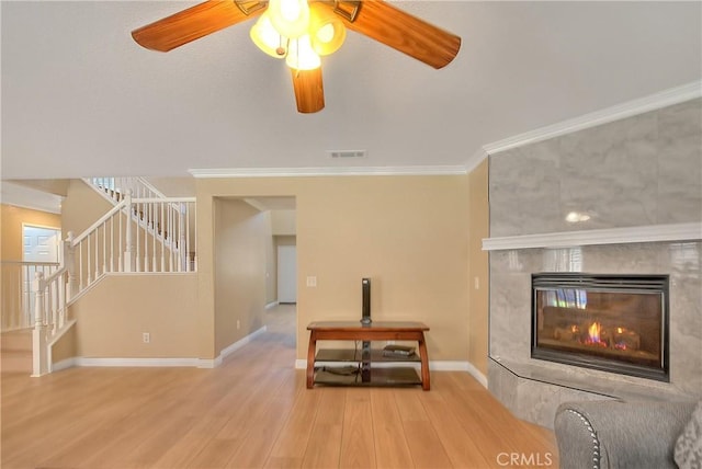 12415 Brianwood Dr, Riverside, CA 92503 - unfurnished living room featuring stairway, wood finished floors, ornamental molding, baseboards, and a ceiling fan