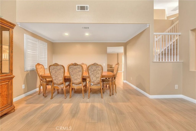 12415 Brianwood Dr, Riverside, CA 92503 - dining room featuring light wood-type flooring, ornamental molding, stairs, baseboards, and recessed lighting