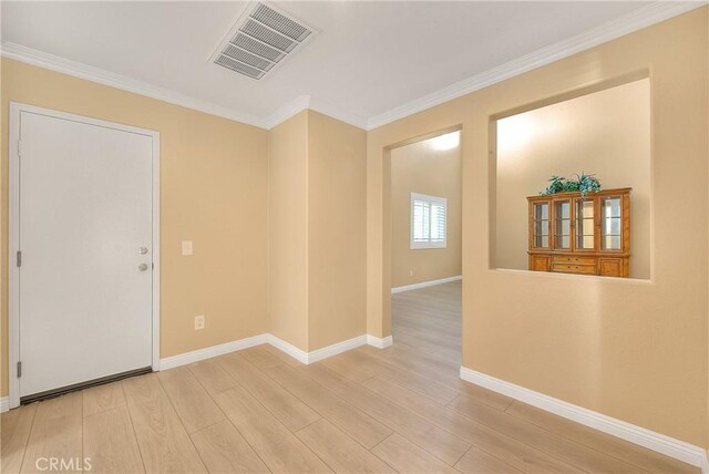 12415 Brianwood Dr, Riverside, CA 92503 - spare room featuring ornamental molding, light wood-type flooring, and baseboards