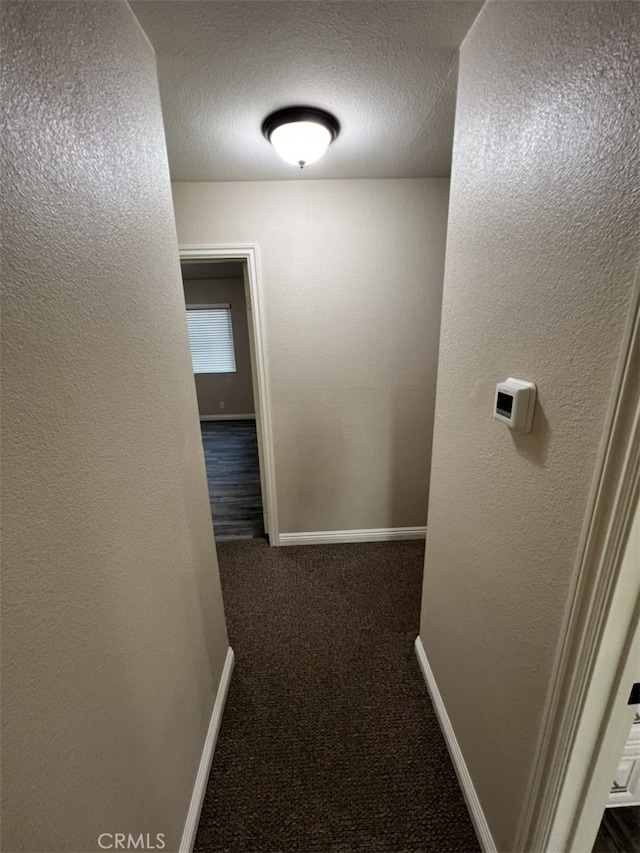 108 Limestone Rd, Claremont, CA 91711 - corridor with carpet, a textured ceiling, baseboards, and a textured wall
