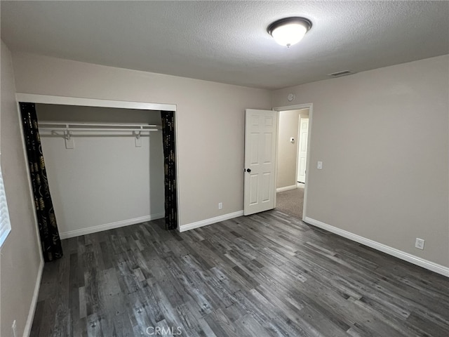 108 Limestone Rd, Claremont, CA 91711 - unfurnished bedroom with dark wood-style floors, baseboards, a closet, and a textured ceiling