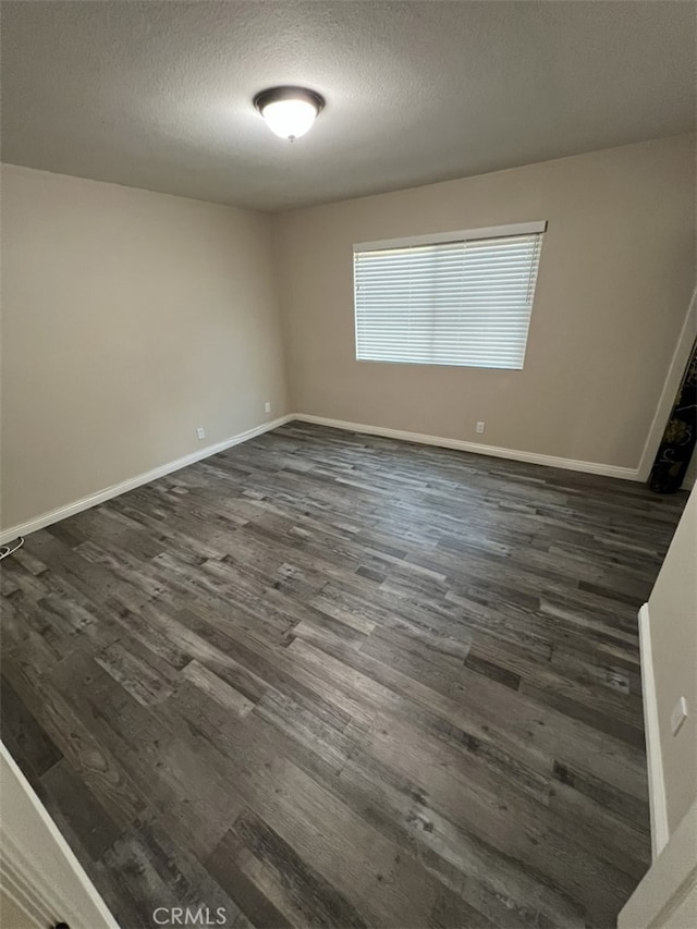 108 Limestone Rd, Claremont, CA 91711 - unfurnished room featuring dark wood-style flooring, a textured ceiling, and baseboards