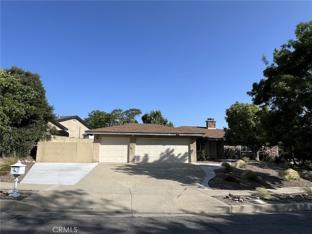 108 Limestone Rd, Claremont, CA 91711 - ranch-style home with a garage, concrete driveway, a chimney, and stucco siding