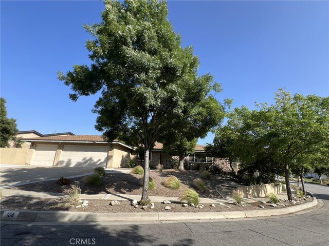 108 Limestone Rd, Claremont, CA 91711 - view of front of property featuring a garage, driveway, and stucco siding