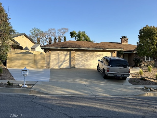 108 Limestone Rd, Claremont, CA 91711 - view of home's exterior featuring driveway, a chimney, and an attached garage