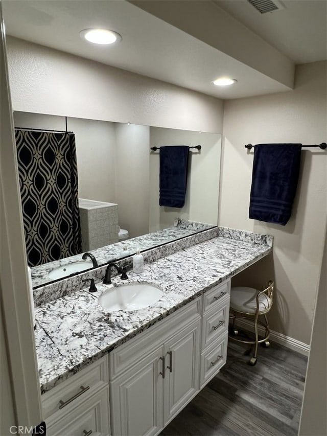 108 Limestone Rd, Claremont, CA 91711 - full bath featuring vanity, wood finished floors, baseboards, toilet, and a shower with curtain
