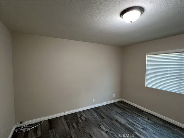 108 Limestone Rd, Claremont, CA 91711 - unfurnished room with dark wood-style floors, baseboards, and a textured ceiling