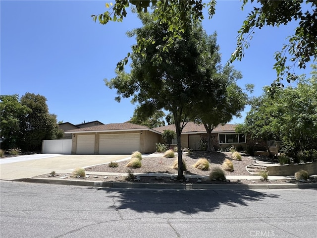 108 Limestone Rd, Claremont, CA 91711 - view of front of home with a garage, concrete driveway, and stucco siding