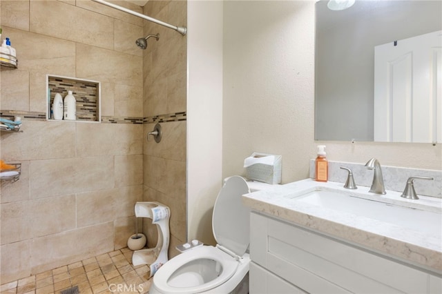 4950 N Treanor Ave, Covina, CA 91724 - bathroom with toilet, tiled shower, and vanity