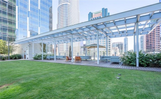 877 Francisco St Unit 1002, Los Angeles, CA 90017 - view of grassy yard with outdoor lounge area, a pergola, and a view of city