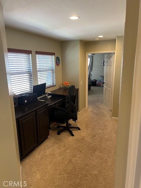 3762 Segovia Dr, Perris, CA 92571 - office area featuring light colored carpet and recessed lighting