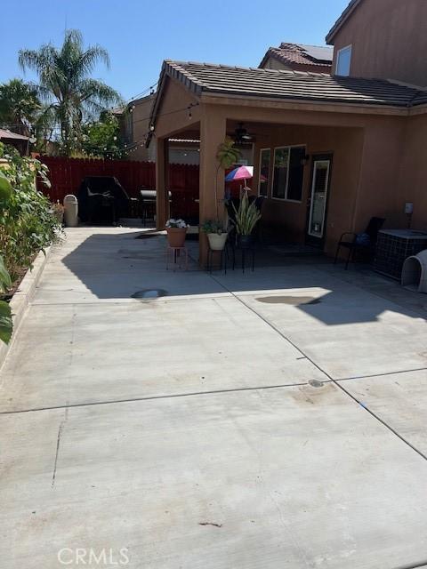 3762 Segovia Dr, Perris, CA 92571 - view of home's exterior with a tiled roof, a patio area, central air condition unit, and stucco siding