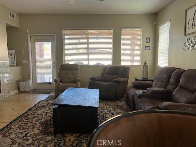 3762 Segovia Dr, Perris, CA 92571 - living room with plenty of natural light and tile patterned floors
