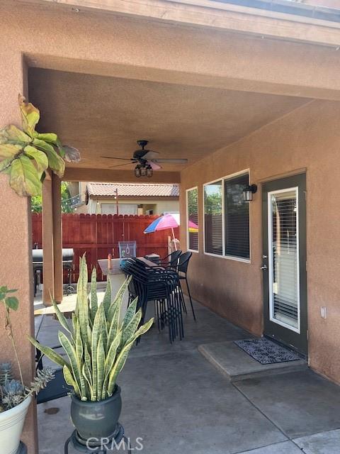 3762 Segovia Dr, Perris, CA 92571 - view of patio / terrace featuring a ceiling fan and outdoor dining space