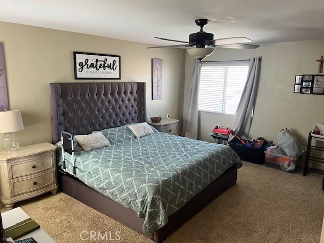 3762 Segovia Dr, Perris, CA 92571 - bedroom featuring light carpet and ceiling fan