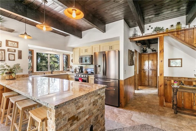 1213 Jungfrau Dr, Crestline, CA 92325 - kitchen with appliances with stainless steel finishes, a wooden ceiling with exposed beams, a peninsula, cream cabinets, and wainscoting