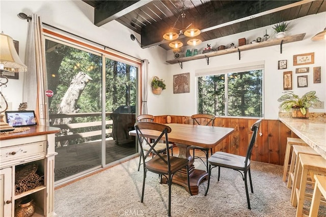 1213 Jungfrau Dr, Crestline, CA 92325 - dining area featuring a wooden ceiling with exposed beams, healthy amount of natural light, and a wainscoted wall