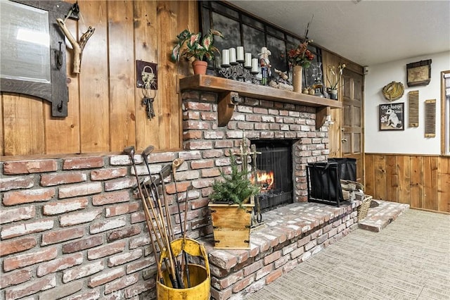 1213 Jungfrau Dr, Crestline, CA 92325 - unfurnished living room with wood walls, a fireplace, a wainscoted wall, and carpet flooring
