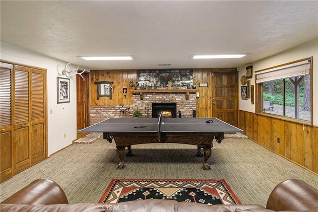 1213 Jungfrau Dr, Crestline, CA 92325 - game room featuring wood walls, pool table, a fireplace, carpet, and wainscoting