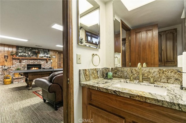 1213 Jungfrau Dr, Crestline, CA 92325 - bathroom with a brick fireplace and vanity
