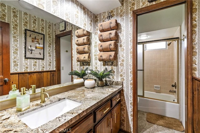 1213 Jungfrau Dr, Crestline, CA 92325 - full bathroom with wallpapered walls, vanity, bathing tub / shower combination, and a wainscoted wall