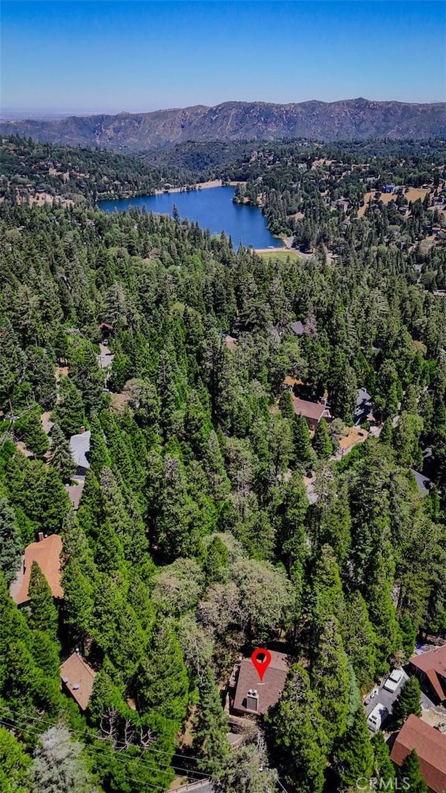 1213 Jungfrau Dr, Crestline, CA 92325 - aerial view of property and surrounding area featuring a heavily wooded area and a water and mountain view