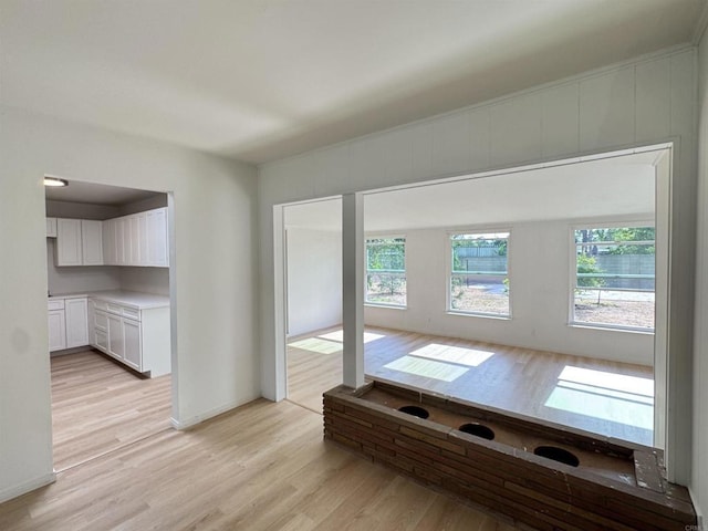 1335 S Hickory St, Anaheim, CA 92805 - unfurnished dining area with light wood-style floors and baseboards