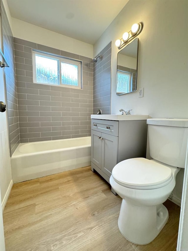 1335 S Hickory St, Anaheim, CA 92805 - bathroom with vanity, shower / bathtub combination, toilet, and wood finished floors