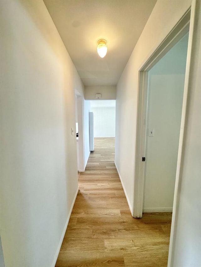 1335 S Hickory St, Anaheim, CA 92805 - hallway featuring light wood-type flooring and baseboards