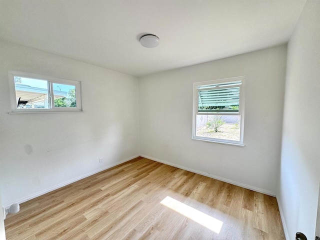 1335 S Hickory St, Anaheim, CA 92805 - empty room with light wood finished floors and baseboards
