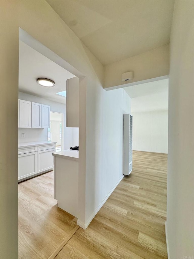 1335 S Hickory St, Anaheim, CA 92805 - hall featuring light wood-style floors, a heating unit, and baseboards