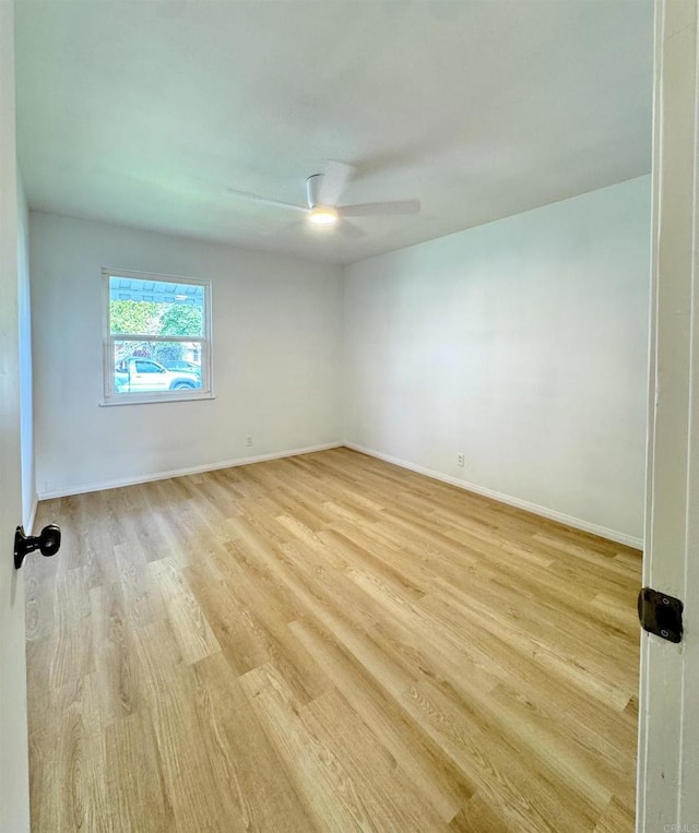 1335 S Hickory St, Anaheim, CA 92805 - empty room with light wood-type flooring, a ceiling fan, and baseboards