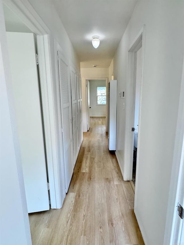 1335 S Hickory St, Anaheim, CA 92805 - hallway featuring light wood-style flooring